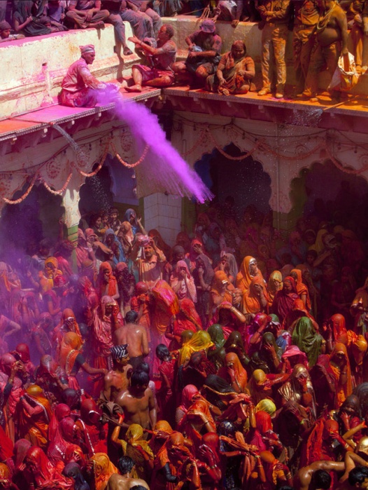 VRINDAVAN, INDIA - MARCH 21: Hindu devotees play with coloured powders during Holi celebrations at the Bankey Bihari Temple on March 21, 2011 in Vrindavan, India. Holi, the spring festival of colours, is celebrated by Hindus around the world in an explosion of colour to mark the end of the winter. (Photo by Majid Saeedi/Getty Images)
